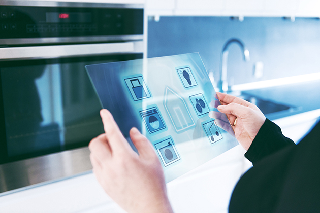 Smart home automation in kitchen controlled by futuristic digital tablet